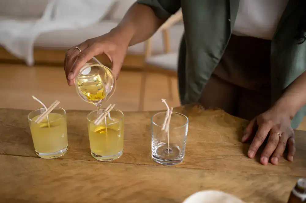Pouring wax into candle glasses